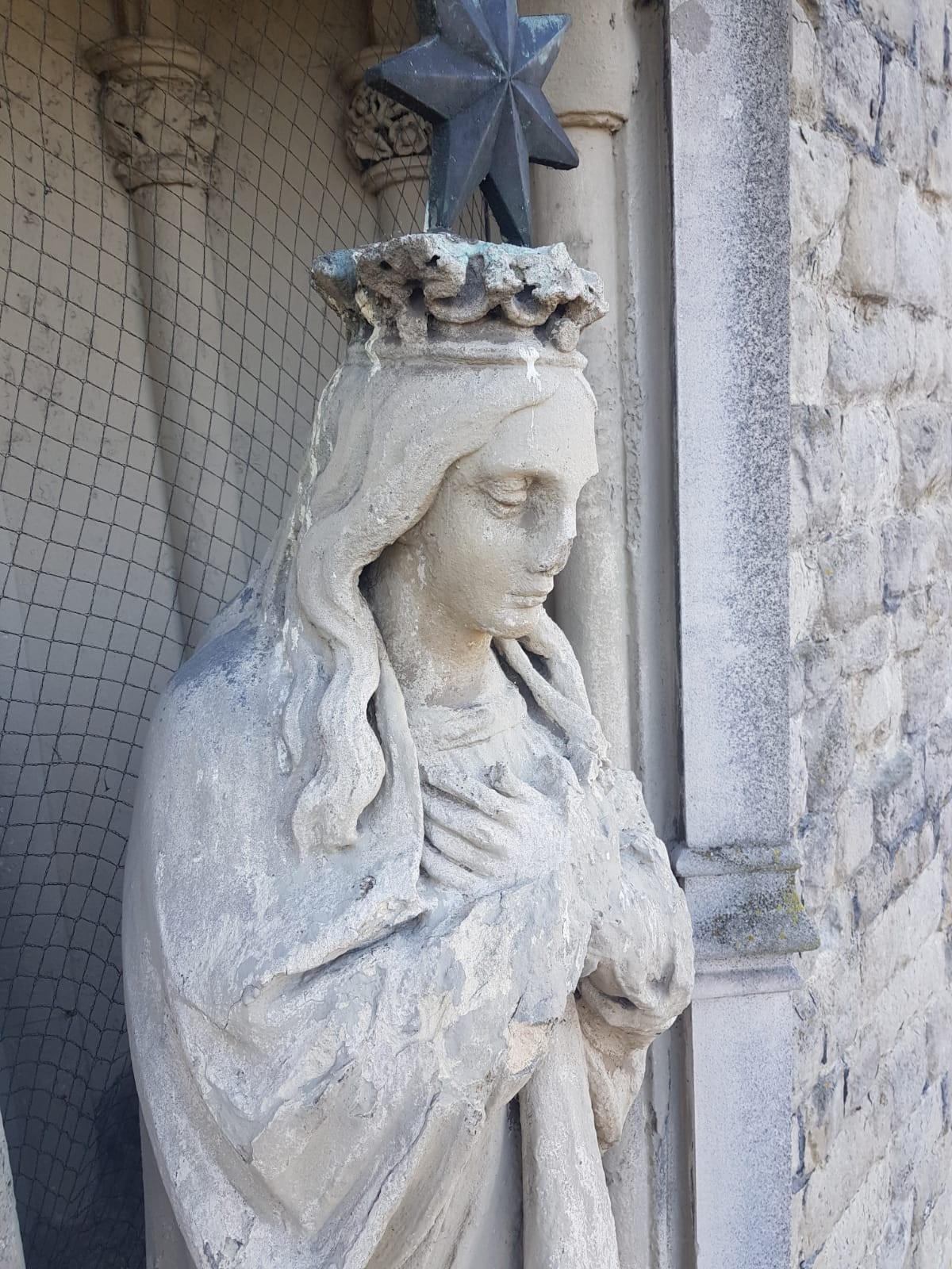 Detail of Our Lady Star statue high up on church front